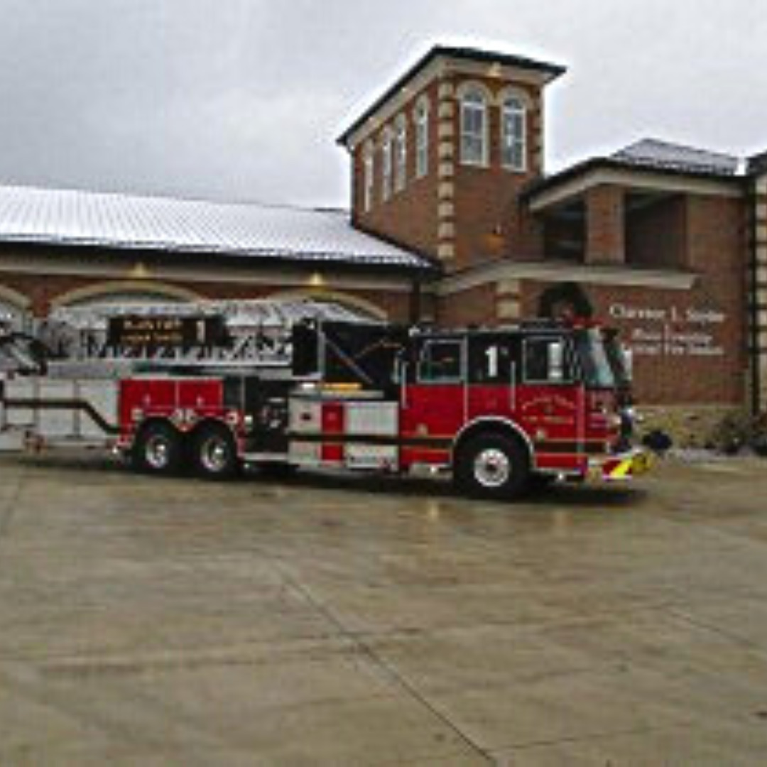 Plain Local Fire Department Truck Outside of Department